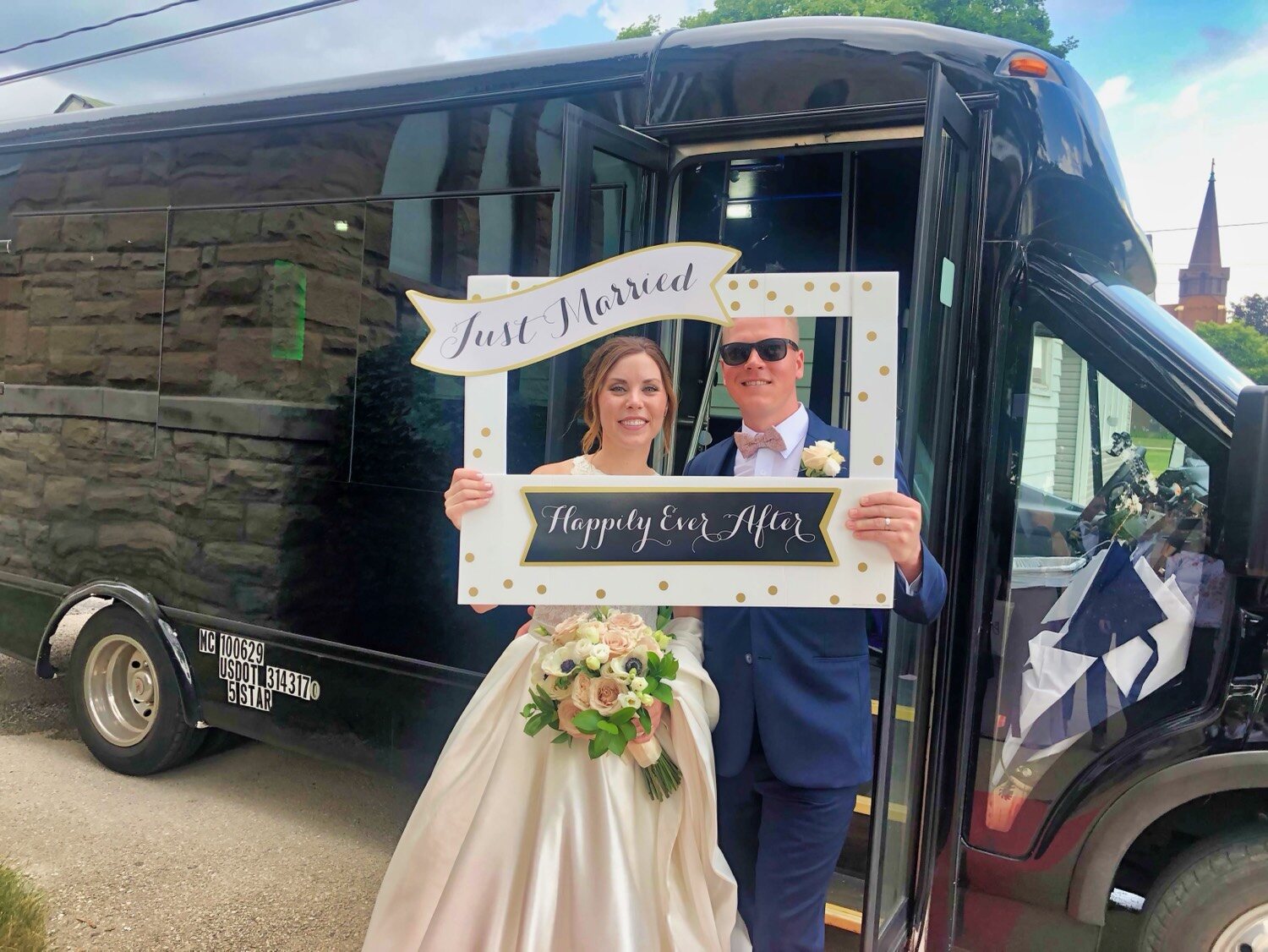 Just married couple with Chicago party bus — Party Bus Rentals wedding 2026