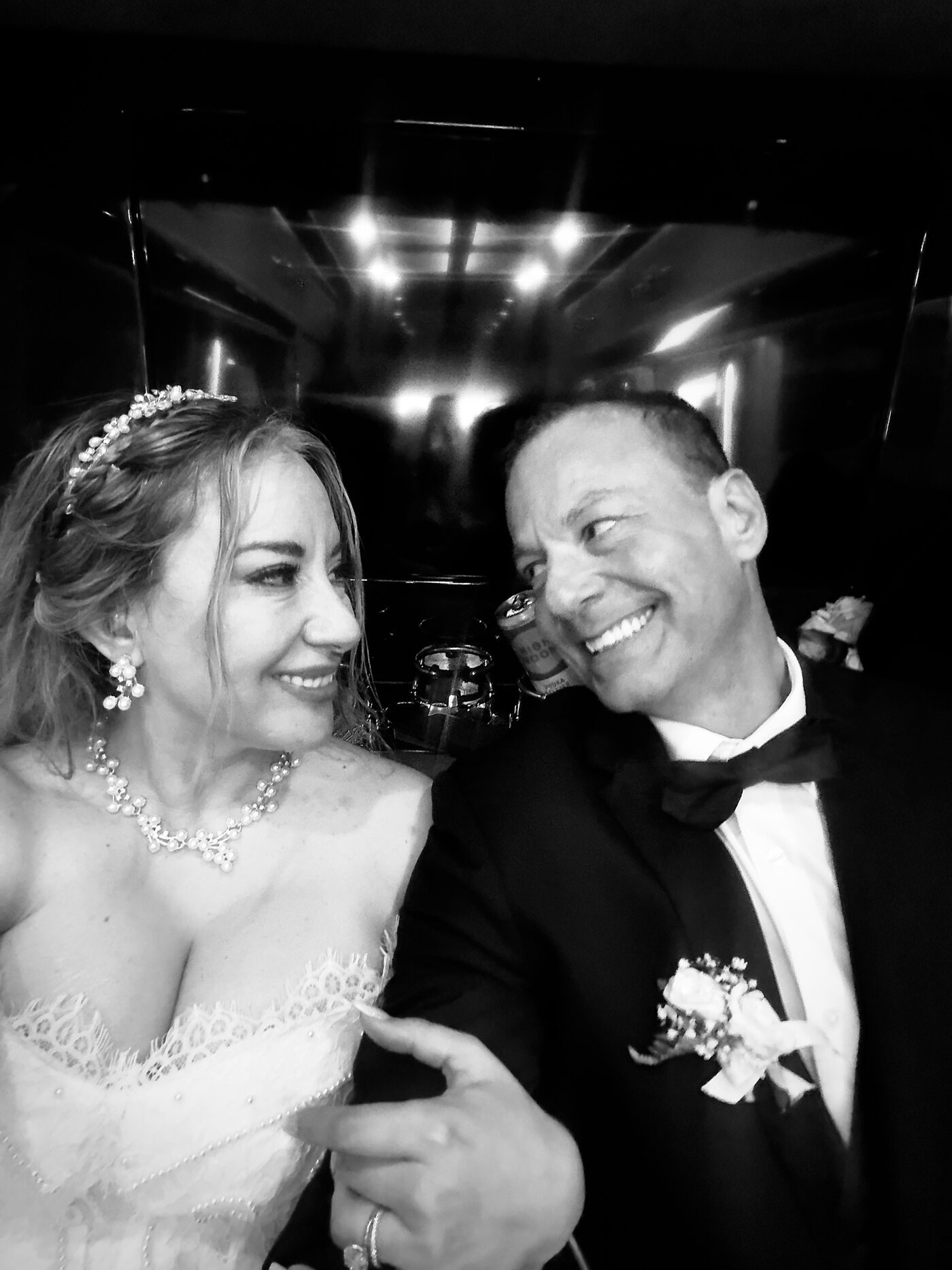 Party bus wedding Chicago — bride and groom in the cabin