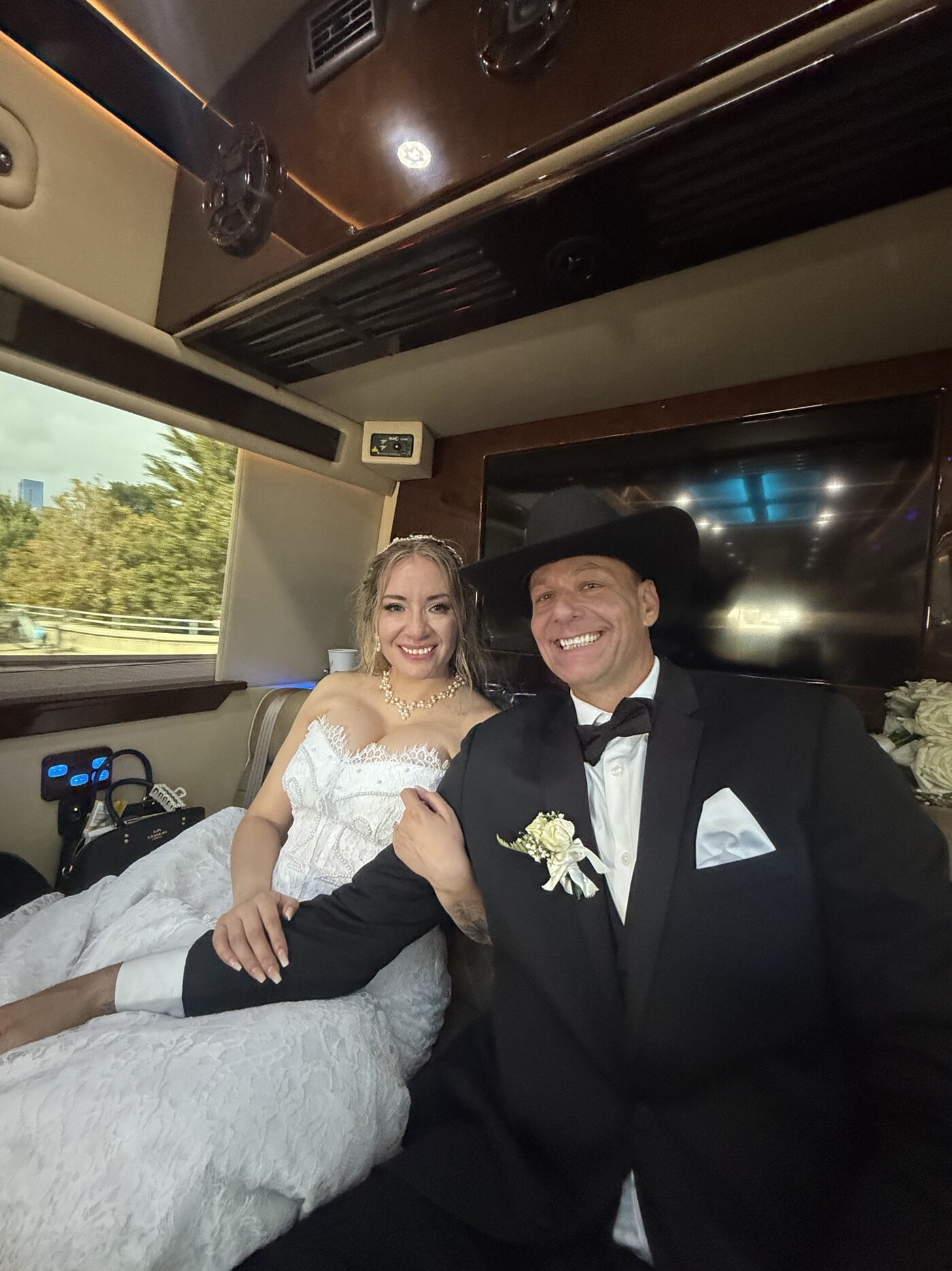 Party bus wedding Chicago — couple riding in the party bus