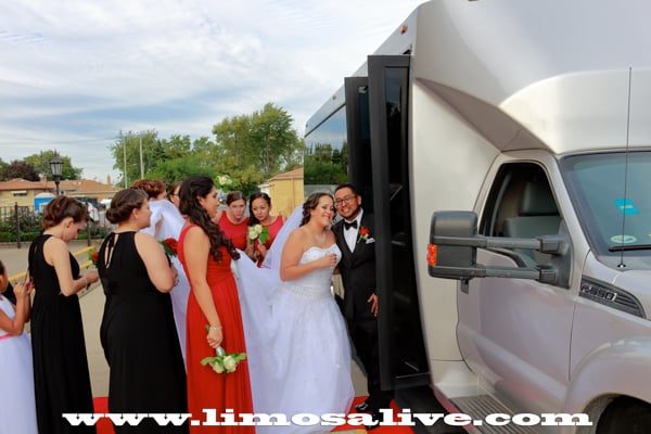 Bride and groom boarding a Chicago party bus